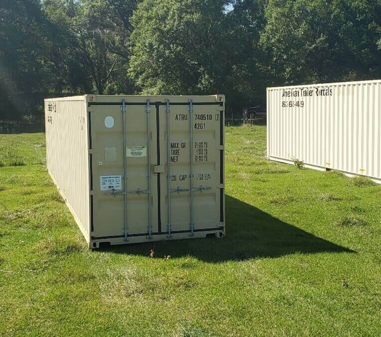 Tan shipping container on grass