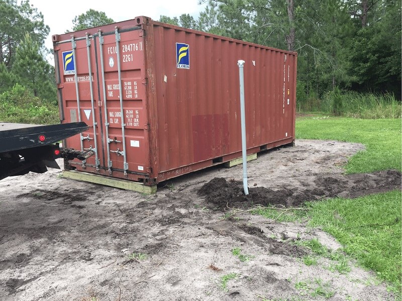 shipping container on wood blocks