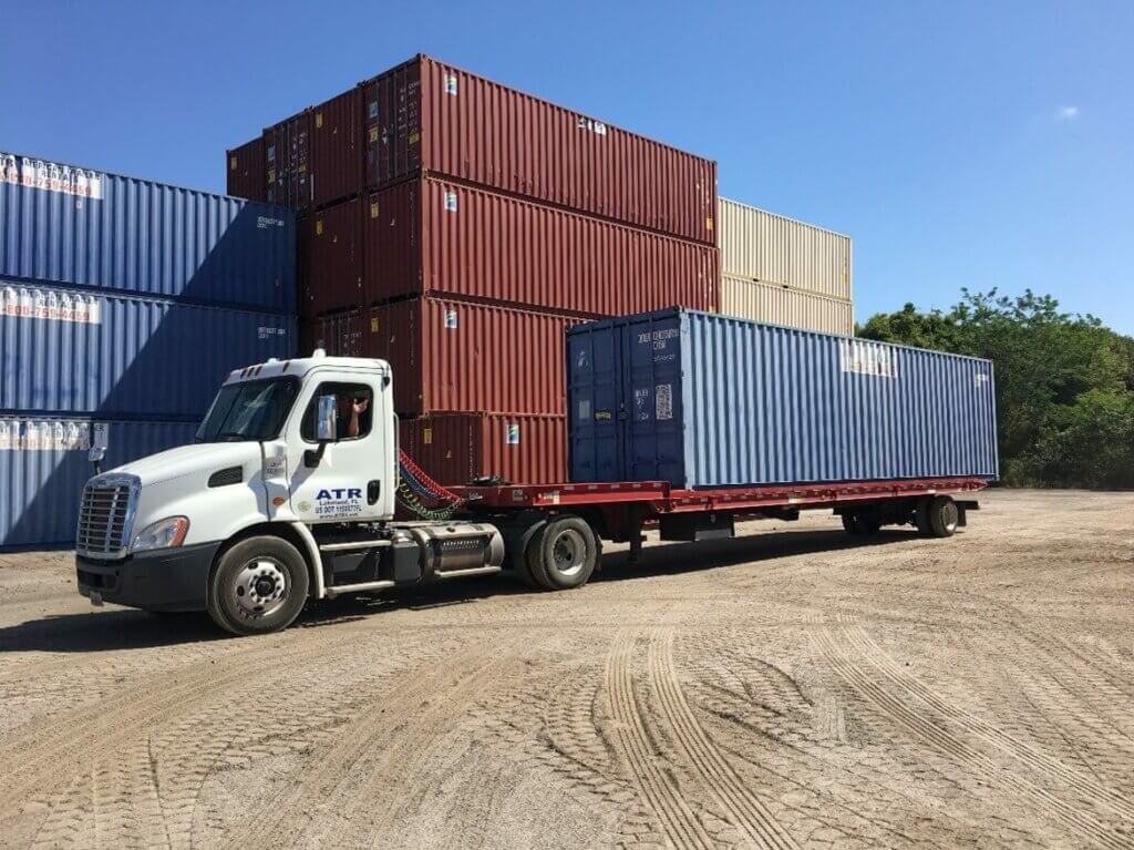 Dave waving at our customers while loaded with a 40' storage container 