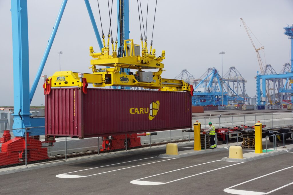 shipping container unloading at port with crane