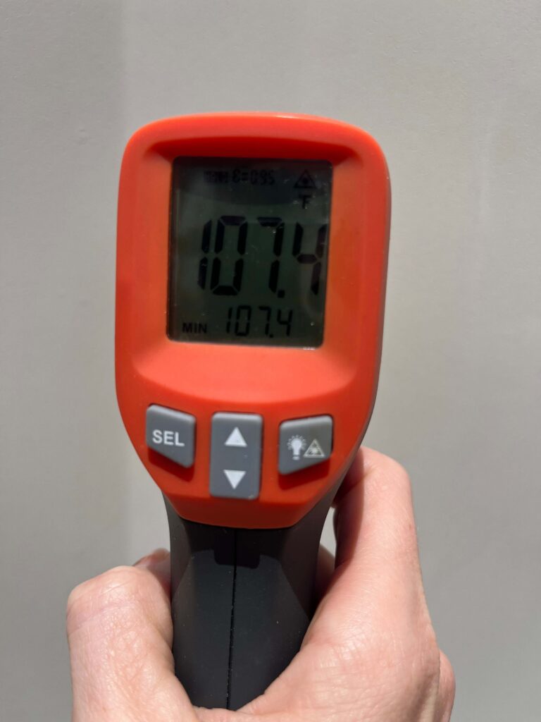 thermometer showing the exterior temp of a storage container