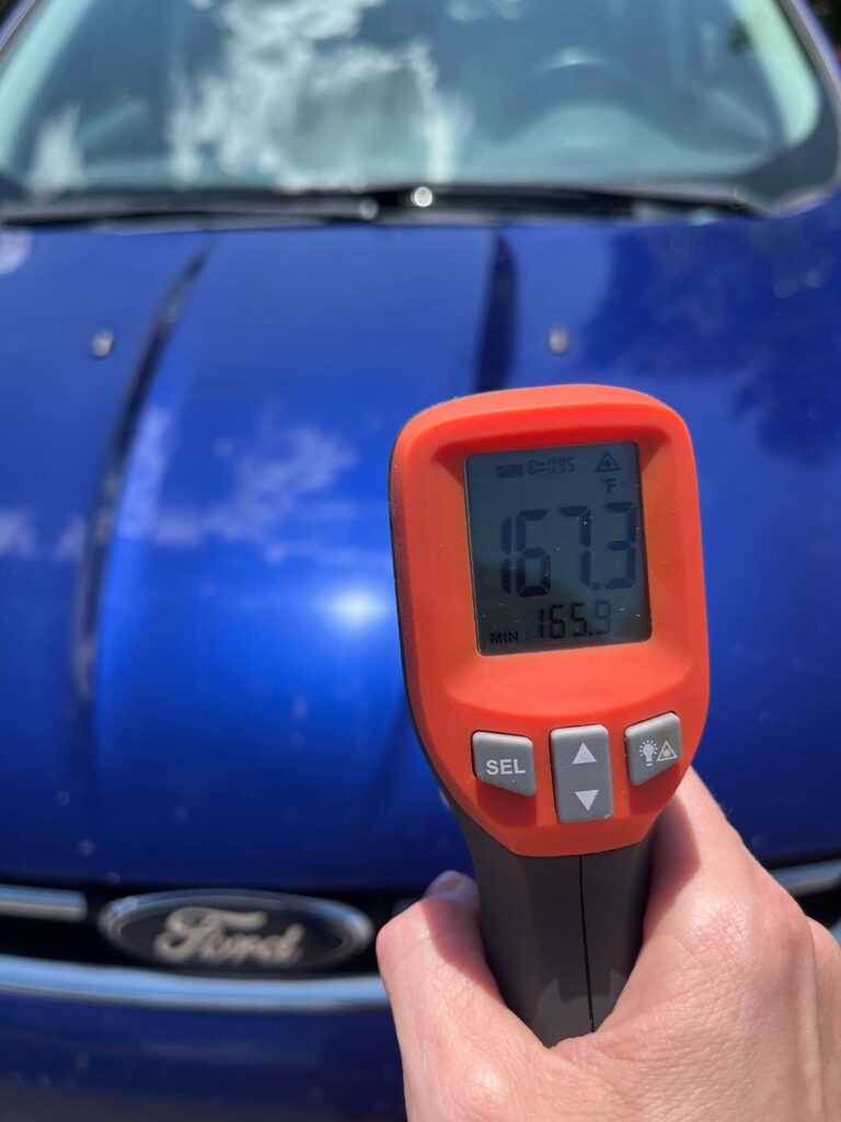 thermometer showing the exterior temp of a blue vehicle